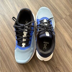 On Running Women’s Blue and Black cloudtec running shoes